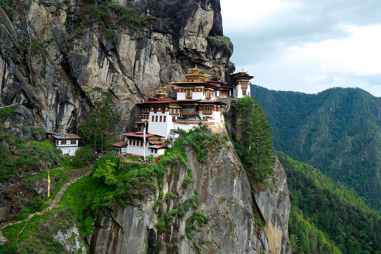 Temples At Tiger'S Nest Perched Precariously On Vertiginous Cliff