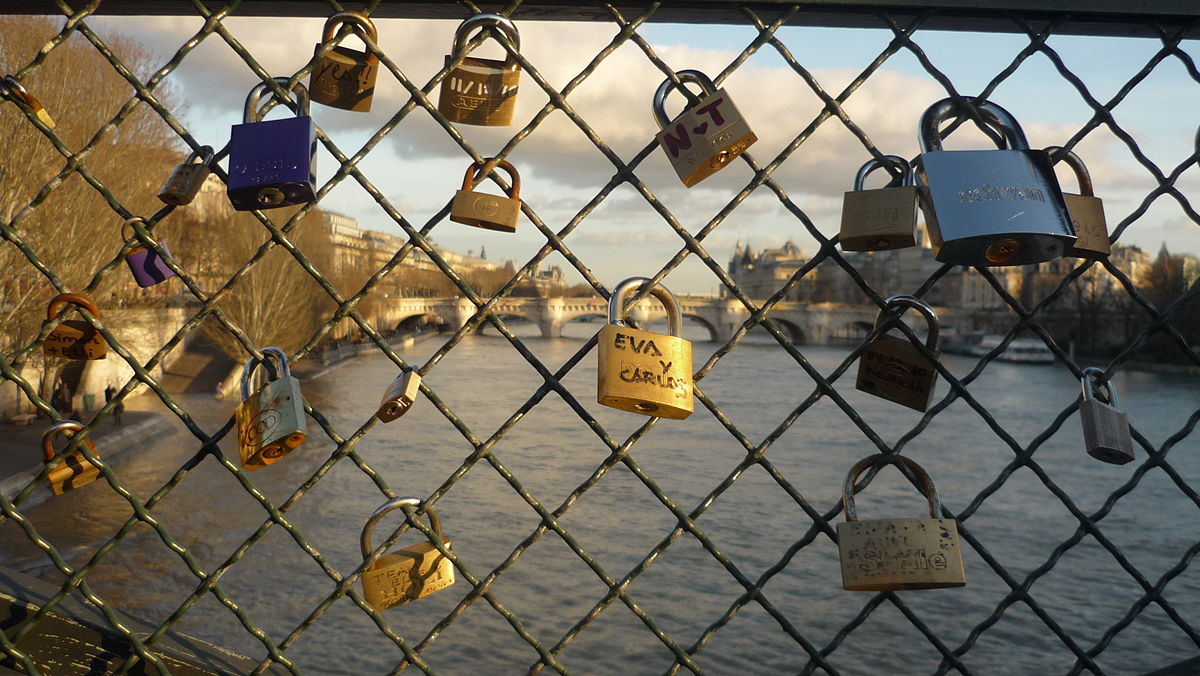 Put a Love Lock on Pont des Arts Bridge in Paris