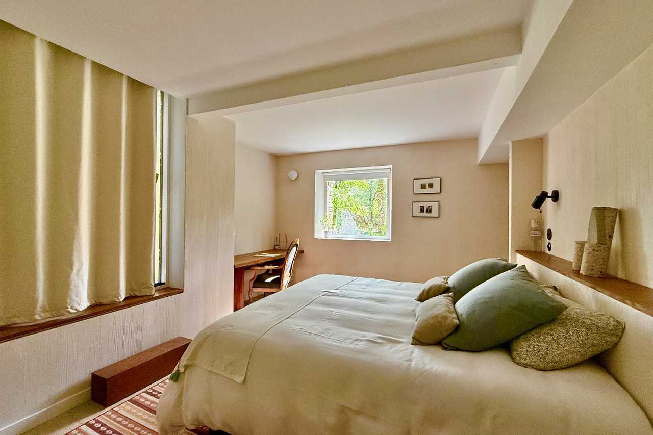 A Bedroom at Maison Les Grands Chênes in the Dordogne