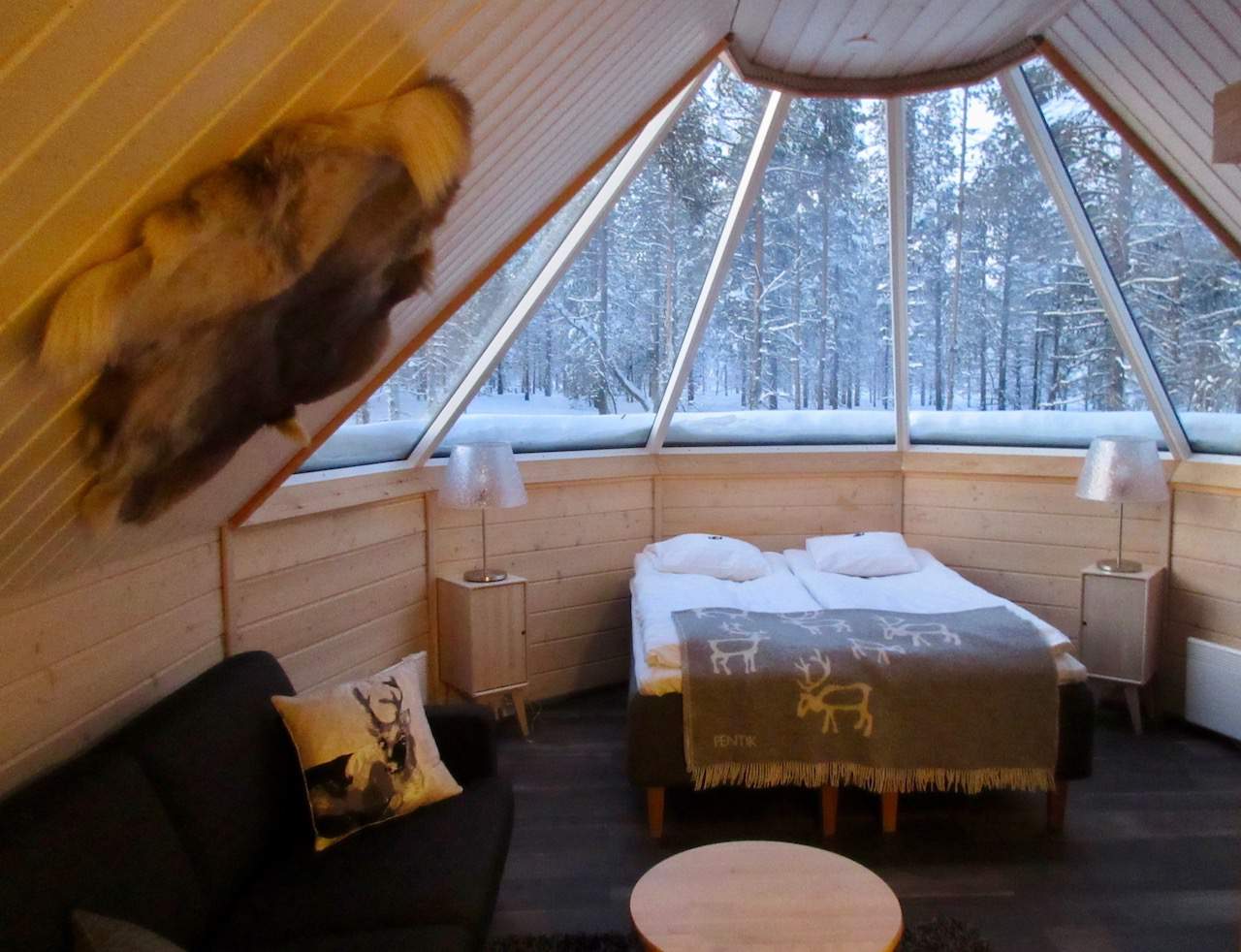 Spend a cosy night in an Aurora Cabin at the Northern Lights Village