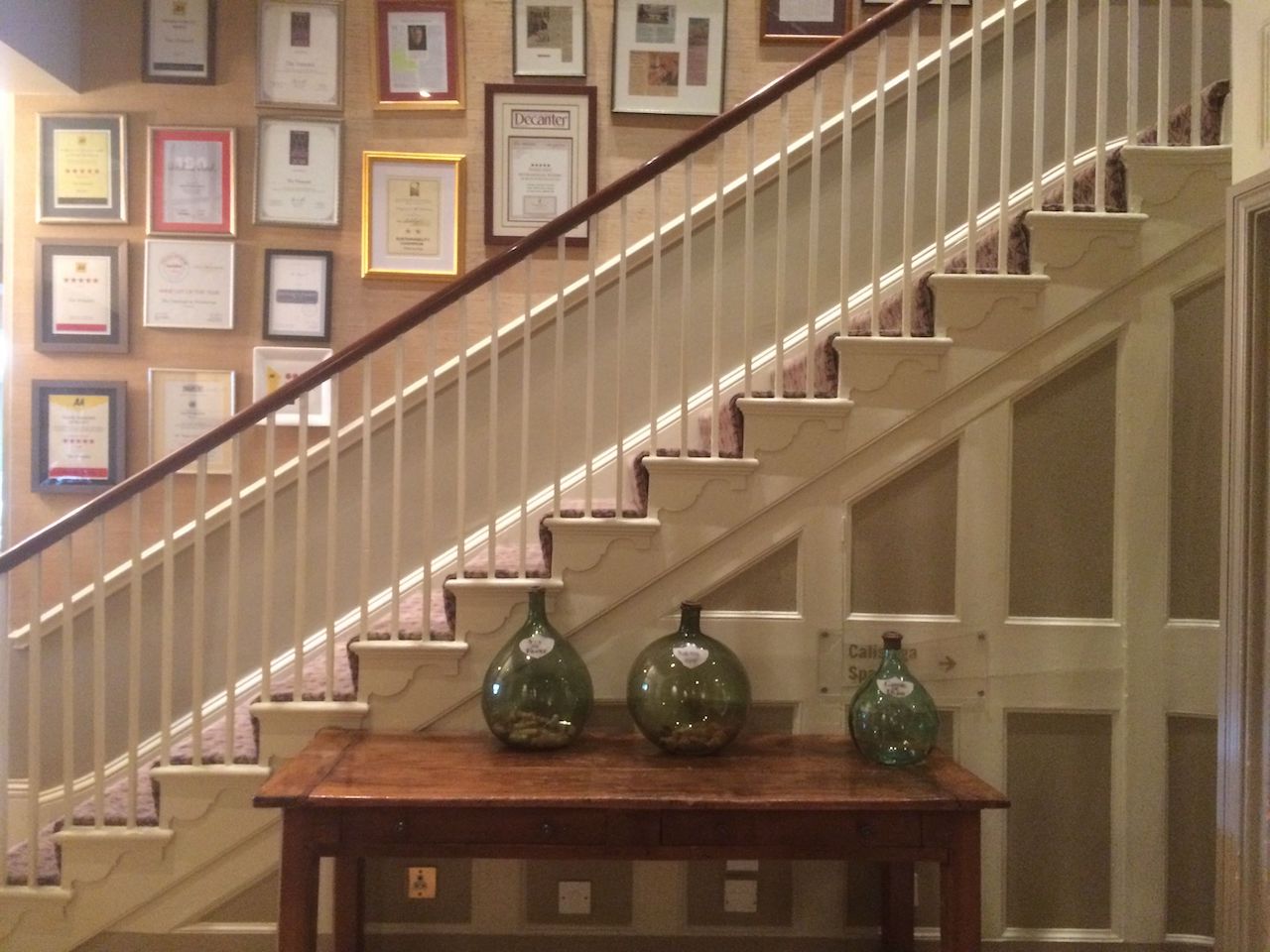 Award certificates line the stairs at The Vineyard Hotel