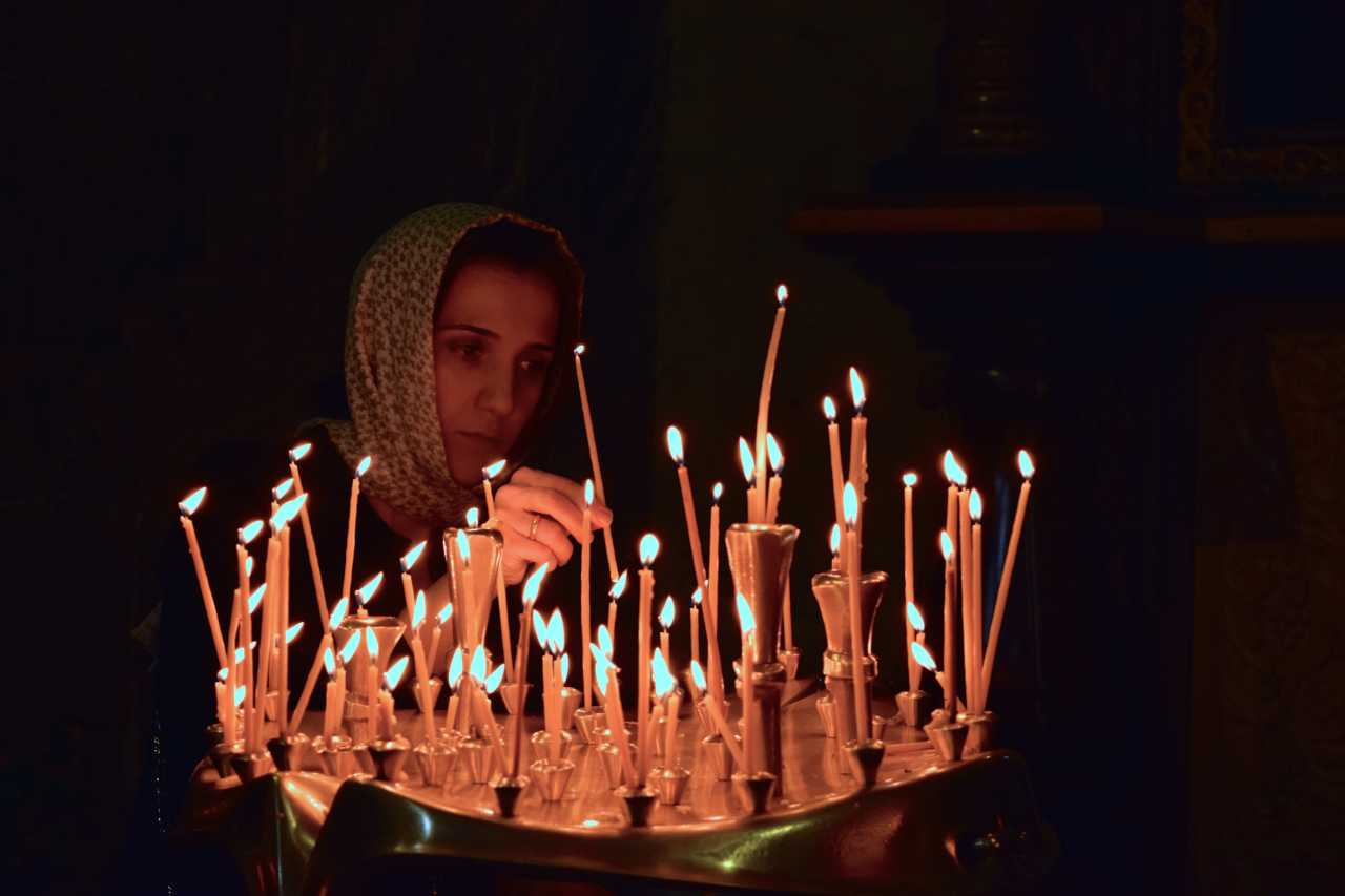 Georgia - Mtskheta - woman praying
