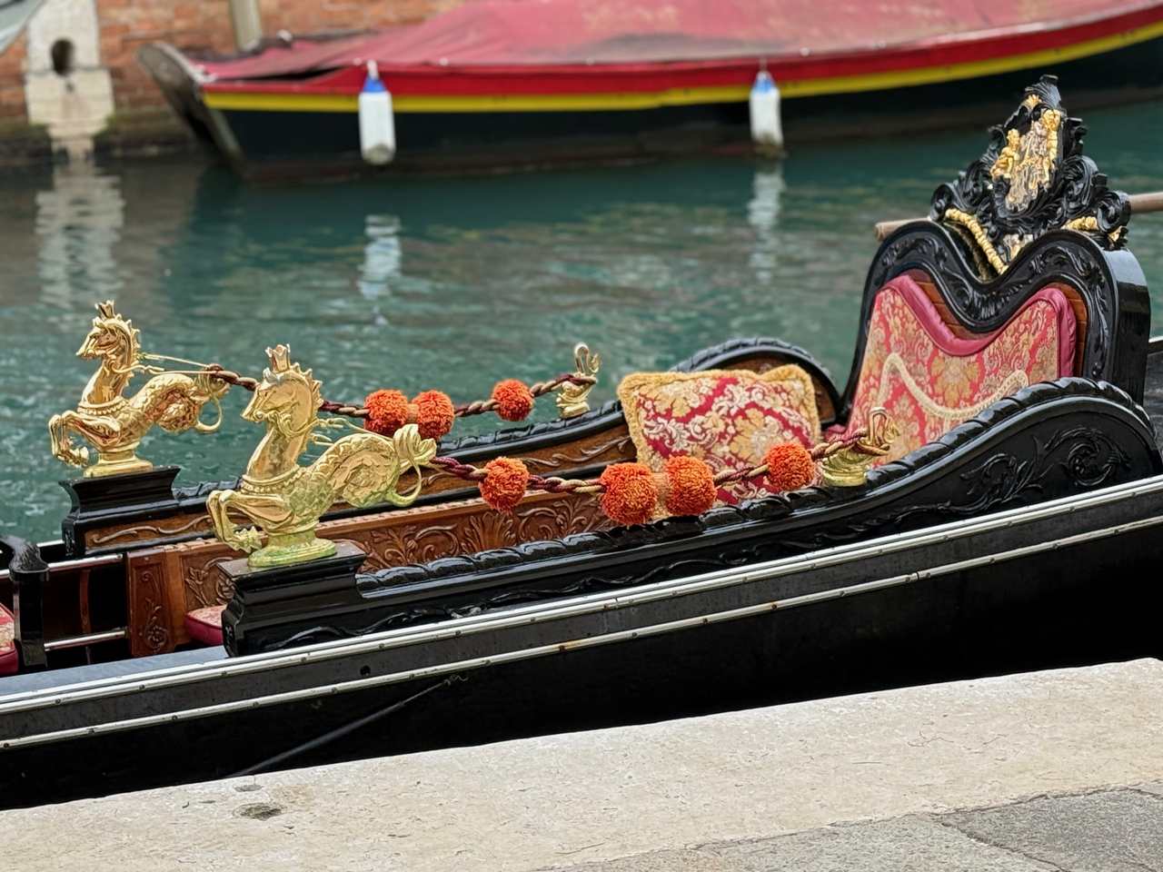 Gilded hippocampi, sculpted woodwork and plush uphostery