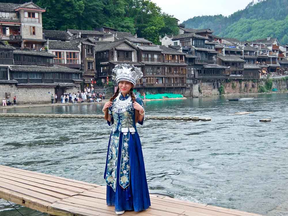 Miao Dressing Up on Bridge