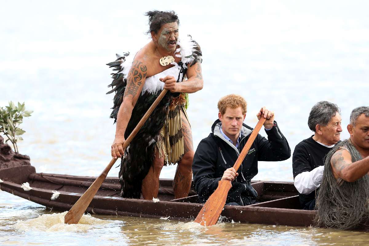 Ned Tapa and Prince Harry paddle a waka down the Whanganui River