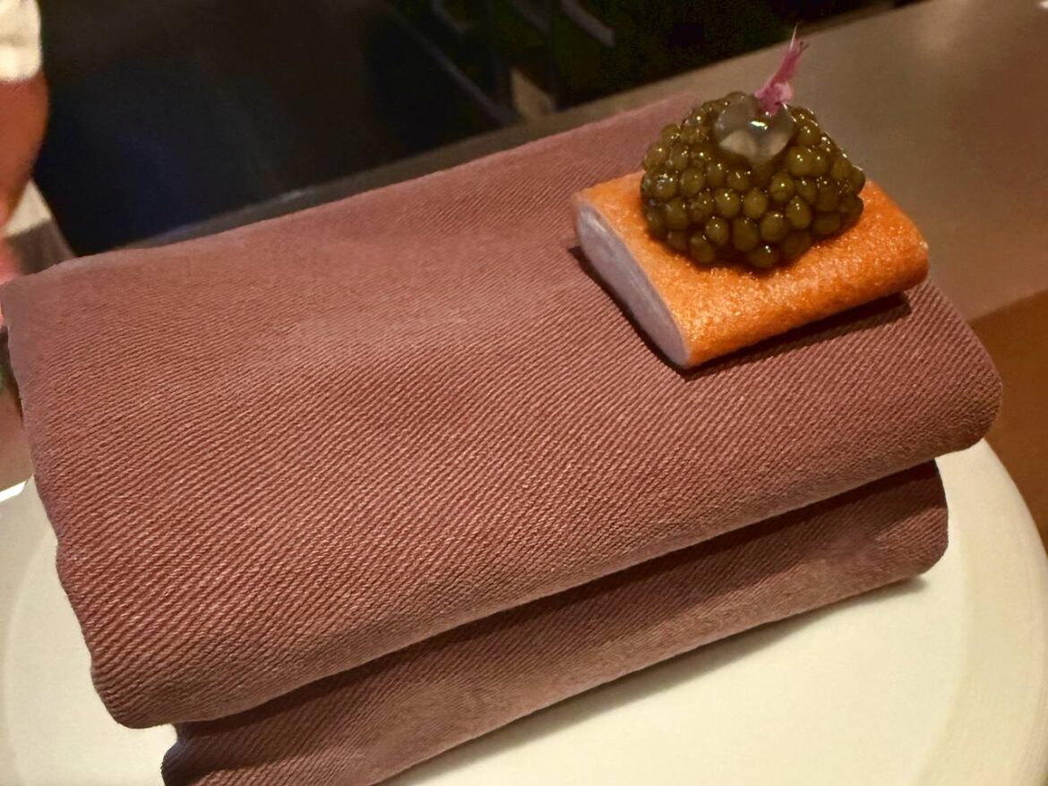 Cheese & onion cracker topped with golden oscietra caviar at The Cocochine restaurant