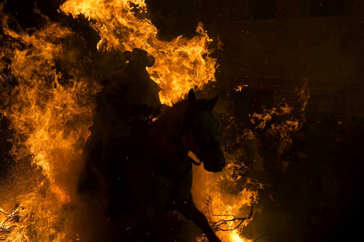horseman running through fire
