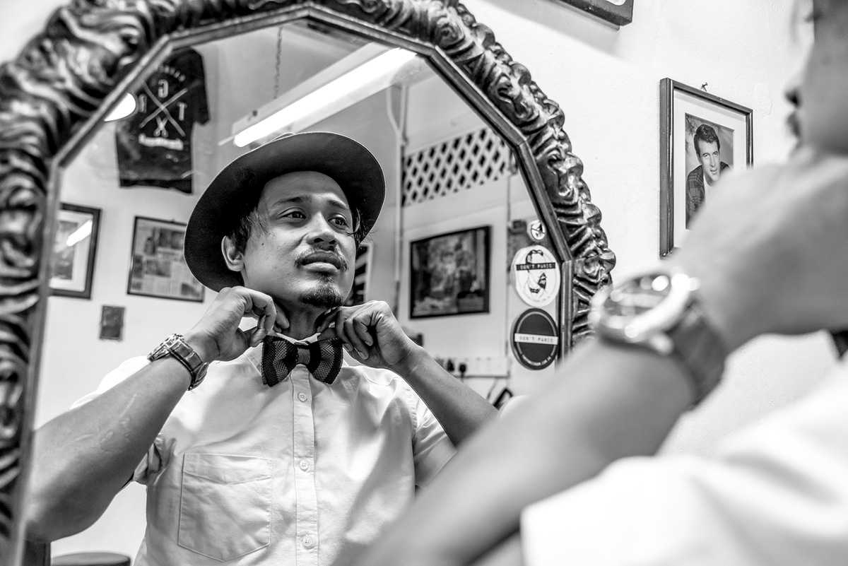 Portrait of Elyas the head barber and owner of Son & Dad Barbers, George Town, Penang, Malaysia