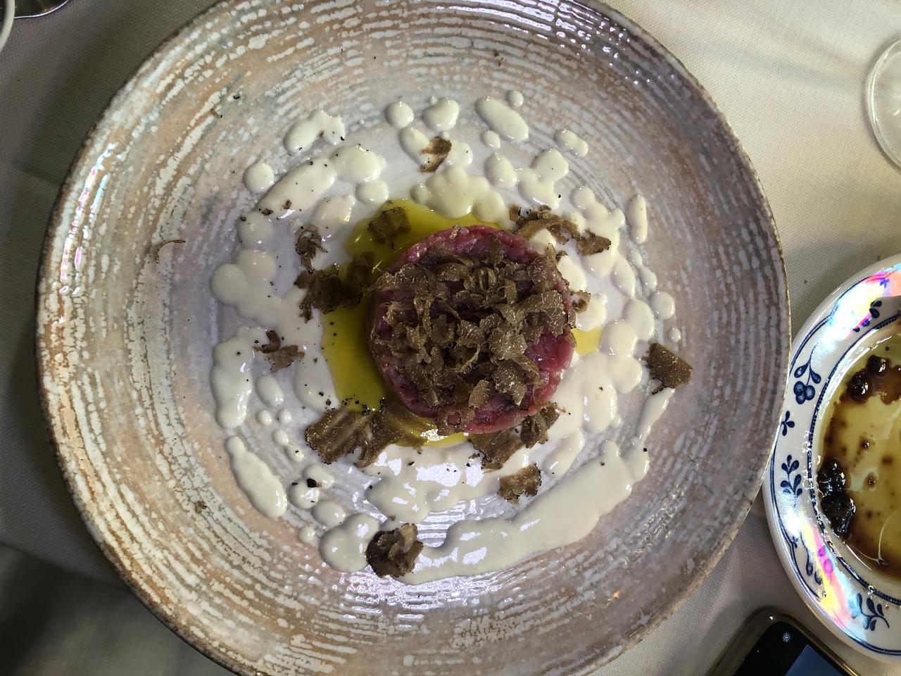 Tartare of beef fillet with parmesan cream and black truffles Osteria del Sole