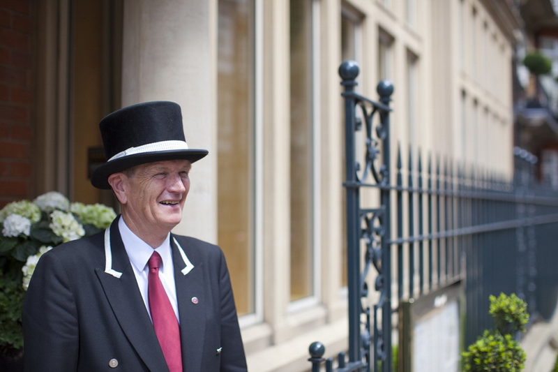 Smiling doorman at The Capital Hotel, London