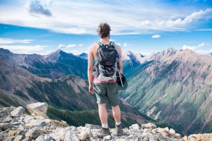 man looking at mountains