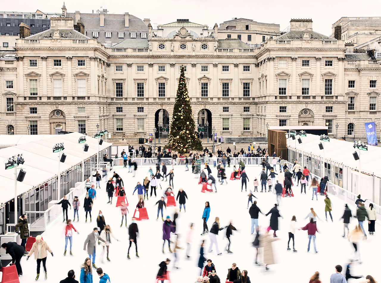 Somerset House Ice RinkPeople ice skating in front of a Christmas tree