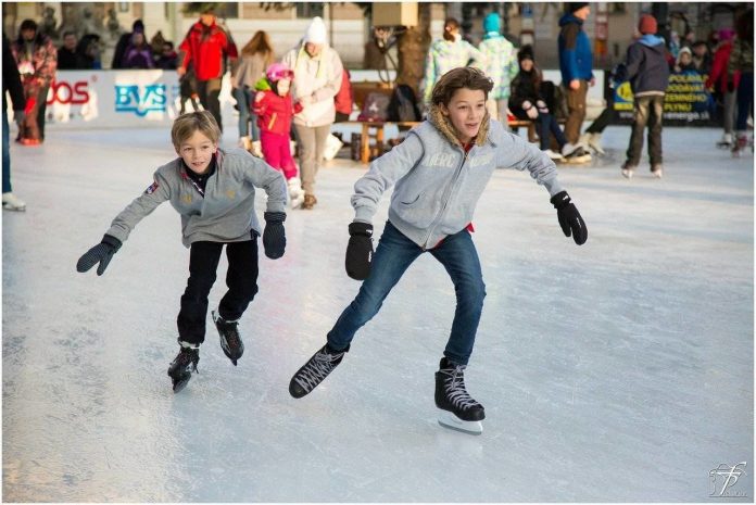 two boys ice skating